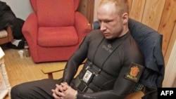 Norwegian right-wing extremist Anders Behring Breivik sits handcuffed and dressed as a police officer moments after his arrest, following a massacre on Utoya Island last year. 