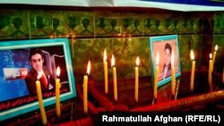 A memorial pays tribute to Yama Siyawash, a former news presenter at Tolo News, and Mohammad Ilyas Dayee, a journalist for Radio Free Afghanistan. The two were killed in magnetic bomb blasts in Helmand and Kabul, respectively, in November.
