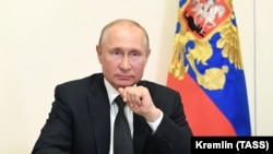 Russian President Vladimir Putin takes part in a video conference call with officials and public representatives of the region of Daghestan on May 18.