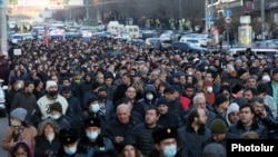 Armenian opposition groups take part in a protest march in Yerevan on February 22.