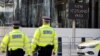 British police officers patrol in front of New Scotland Yard, central London. (file photo)