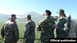 Foreign military attaches visit an area in Armenia's Syunik Province where Armenian and Azerbaijani troops are locked in a border standoff on May 20.