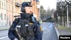 Swedish police guard the Israeli Embassy in Stockholm.