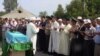 A memorial service in June 2012 for one of the 14 border guards who died in the late-May killings on the Kazakh-Chinese border.