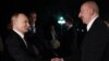 Vladimir Putin (left) is greeted by his Azerbaijani counterpart, Ilham Aliyev, upon the Russian president's arrival in Baku on August 18. 