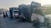 Gunmen burned several vehicles before fleeing the scene in the Musakhail district of Pakistan's Balochistan Province on August 26.