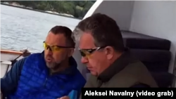 A video appears to show billionaire Oleg Deripaska (left) and Russian Deputy Prime Minister Sergei Prikhodko meeting on board the tycoon's yacht.