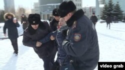 Kazakh police detain protesters in Astana amid antigovernment rallies across the country last month.