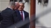 Hungarian Prime Minister Viktor Orban (right) greets Charles Michel, the president of the European Council, on his arrival for a meeting in Budapest on November 27.