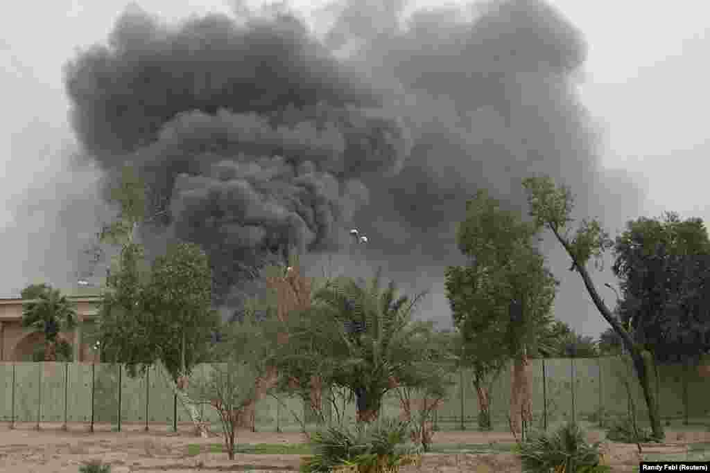 Plumes of smoke rise from the U.S. Embassy compound in March 2008 after Iranian-backed militias shelled Baghdad's Green Zone. Quds Force commander Soleimani played such a pivotal role in Iraq’s security through various militia groups that U.S. General David Petraeus, the overall head of U.S. forces in Iraq at the time, sent messages to him through Iraqi officials.