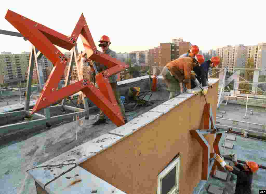 A communist red star is removed from a factory in Budapest in 1989. This October 26, 1989, photo was taken three days after Hungary proclaimed itself a democracy after 40 years under Soviet-backed communist rule. The image is one of several that plot the momentous events that transformed Hungary 35 years ago. 