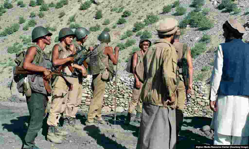 Young Soviet troops demining a road in Afghanistan. The U.S.S.R.’s military invasion of Afghanistan was launched in a bid to prop up an embattled communist regime in Kabul. 