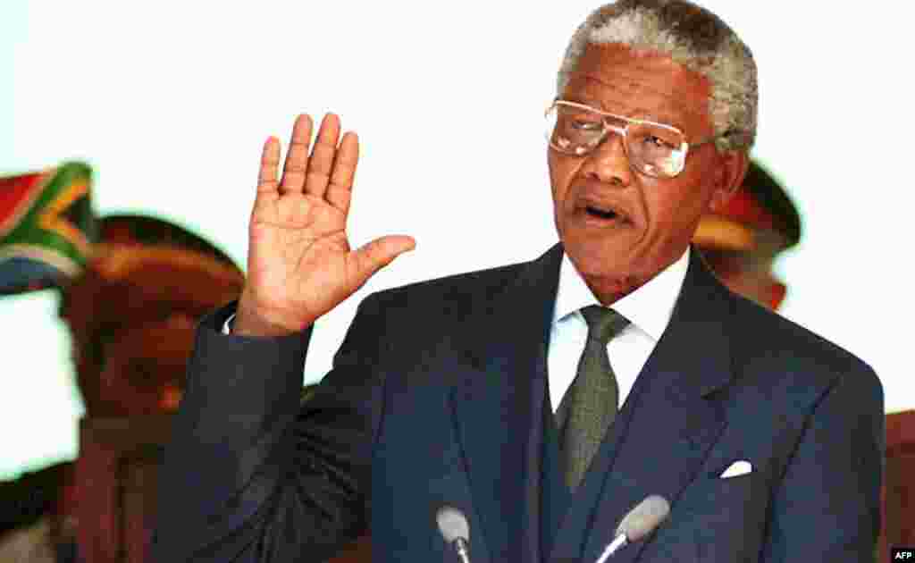 Nelson Mandela takes his oath of office during his presidential inauguration in Pretoria in May 1994.&nbsp;