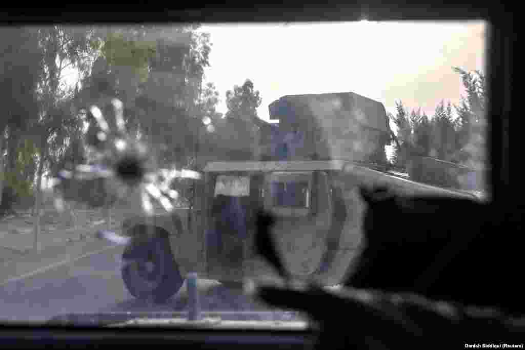 A Humvee wrecked during the July 13 rescue mission. Three of the eight vehicles used in the operation took direct hits from RPGs and had to be left behind. 