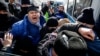 Полицейские проводят задержания людей на месте, обозначенном оппозиционными группами в качестве площадки для проведения митинга. Алматы, 28 февраля 2021 года.