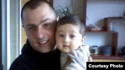 Aramais Avakian with his one-year-old daughter.