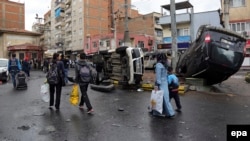 Residents of the Baglar district carry their belongings as they leave after clashes between Turkish special forces and militants of the outlawed Kurdistan Workers Party (PKK) in Diyarbakir, Turkey, on March 15.