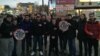 Stopkham activists line up for a photograph before traveling to a traffic-clogged highway for an evening of activism in Moscow.