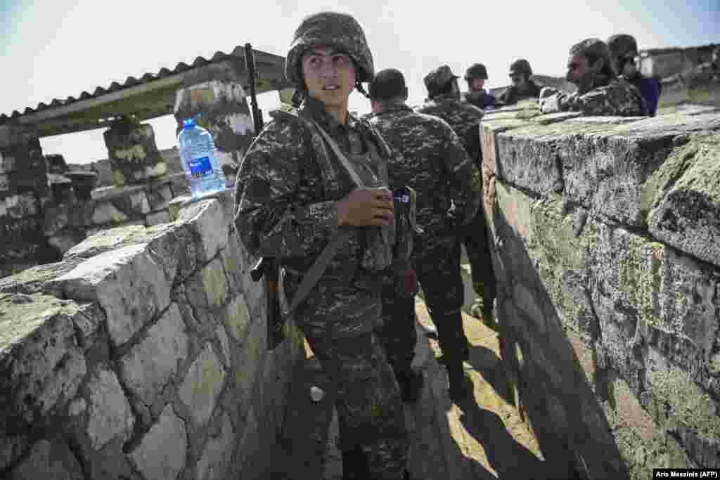 An Armenian soldier on the front line as troops fight to hold positions on October 18. 