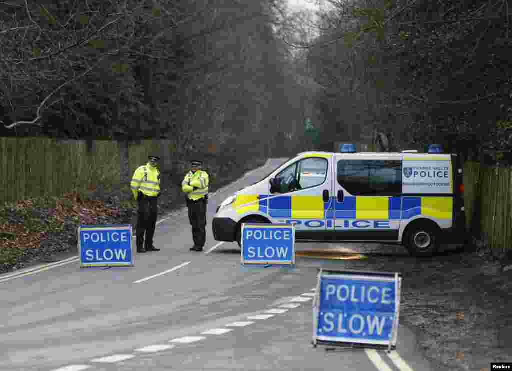 A police cordon blocks the road leading to Boris Berezovsky's house after he was found dead at his home near Ascot in Berkshire in as yet unexplained circumstances on March 23, 2013. 