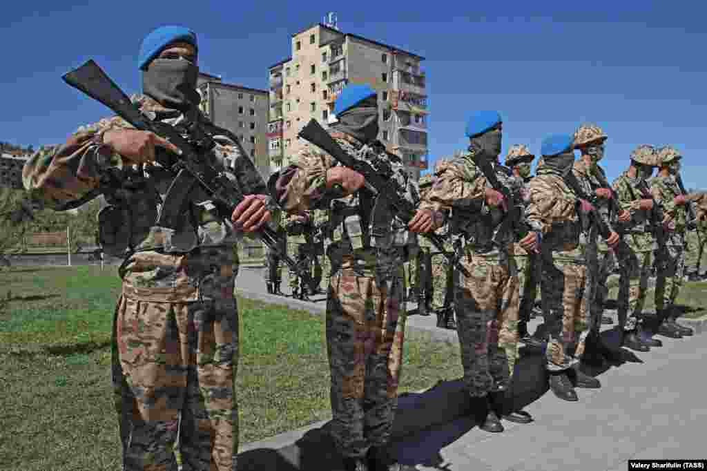 Azerbaijani servicemen during a parade in Susa/Shushi on September 27. In a speech, Azerbaijan’s authoritarian president referred to the 2020 fighting, in which vast tracts of Azerbaijani land was retaken from ethnic Armenian fighters, as a “holy war” and declared, “From now on, we will live as a victorious country, a victorious people, and we will build and restore the liberated lands.” 