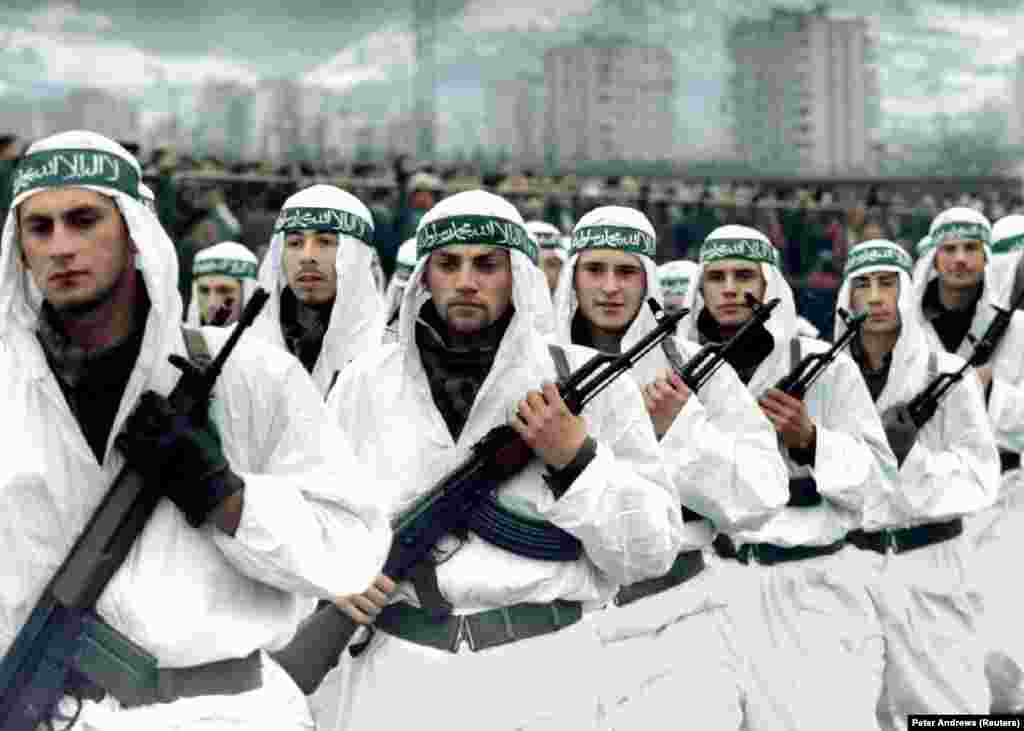 A Muslim brigade of the Bosnian Army marches in a parade in Zenica in 1995. Bin Laden is also widely believed to have been involved in helping channel foreign jihadists to fight alongside Bosnian Muslims during the wars in the 1990s in former Yugoslavia. The foreign Islamist fighters were notorious for their brutality. 