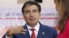 Georgia -- President Mikheil Saakashvili speaks at a polling station during a parliamentary election in Tbilisi, 01Oct2012