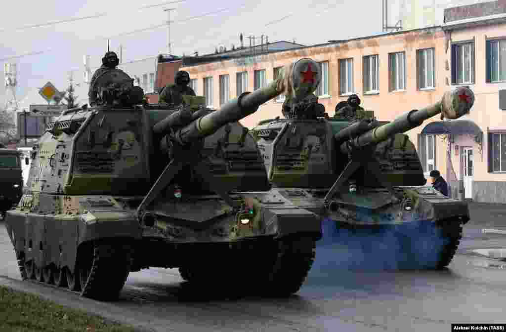 Russian servicemen drive self-propelled howitzers along a street in Yekaterinburg. Officials are considering holding Victory Day events without veterans, who could be more vulnerable to the coronavirus.