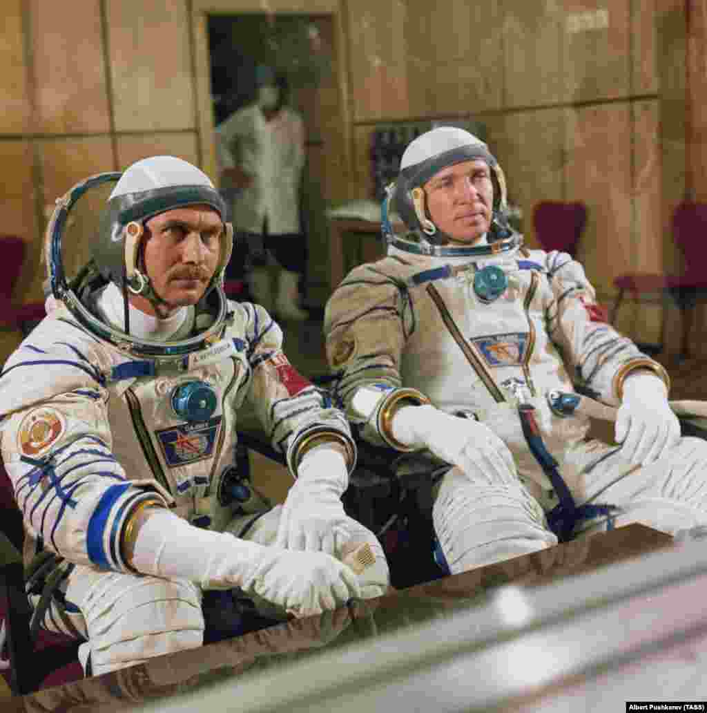 Cosmonauts Anatoly Berezovoy and Valentin Lebedev speak to the media behind glass before a launch in 1982. Several Soviet prelaunch traditions continue today, including sitting together for a screening of the 1970 film The White Sun Of The Desert and urinating on the back wheel of the bus that transports space travelers to the launchpad. Female cosmonauts and astronauts reportedly bring along a small vial of urine for the ritual tire splash. &nbsp; &nbsp;