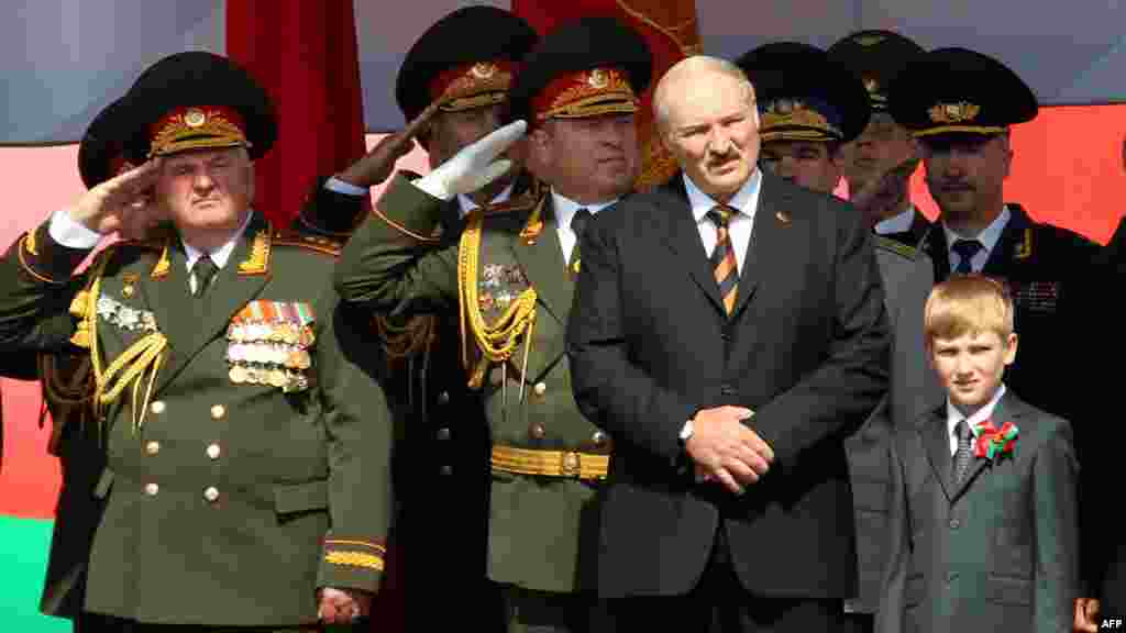 Lukashenka and Kolya watch a military parade to mark the nation's Independence Day in central Minsk in July 2012.